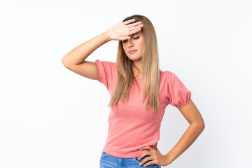 Young blonde woman over isolated white background with tired and sick expression