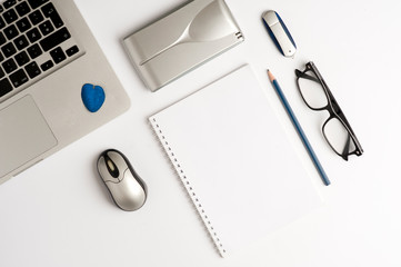 Office desk or educational desk with laptop, white sheet book, glasses to see, external hard drive,...