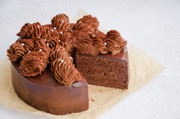 Chocolate Birthday cake. Homemade delicious chocolate cake on a light background. Sweet food. Sweet dessert. Close up. Horizontal orientation.