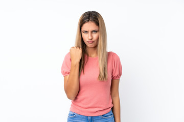Fototapeta premium Young blonde woman over isolated white background with angry gesture
