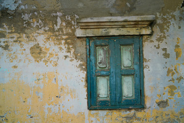 Vintage green window of old wall in Thailand.