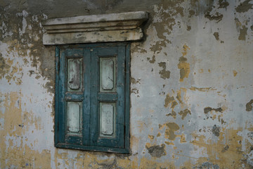 Vintage green window of old wall in Thailand.