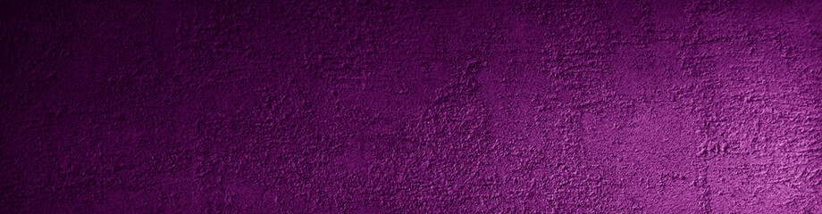 Violet grunge background. Rough concrete wall texture in reflection of light closeup. Purple grunge banner with copy space for your design.