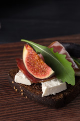 Figs. Sandwiches with figs, cheese, arugula, honey and nuts. toast with creamy yogurt and feta cheese spread, fresh figs with honey. Bruschetta with cheese and figs. Homemade. Everyday autumn kitchen.
