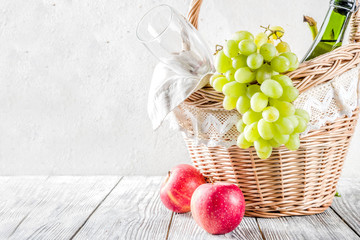 Picnic basket with fruit bread and wine