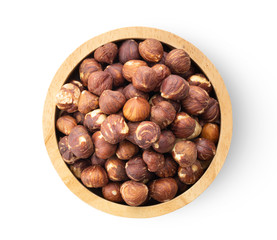 hazelnuts in wood bowl  isolated on white background