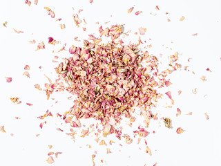 Close up of dry rose petals spread on white