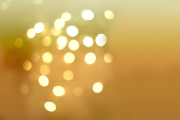 Abstract background of soft golden bokeh 