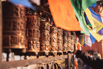 Buddhist prayer wheel at Swayambunath stupa, monkey temple, Kathmandu, Nepal - obrazy, fototapety, plakaty