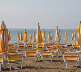 many closed sunshade on the beach