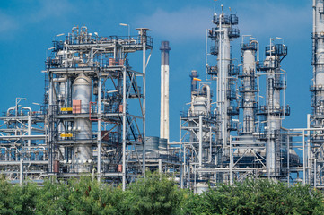 Fototapeta na wymiar Industrial zone,The equipment of oil refining,Close-up of industrial pipelines of an oil-refinery plant,Detail of oil pipeline with valves in large oil refinery.