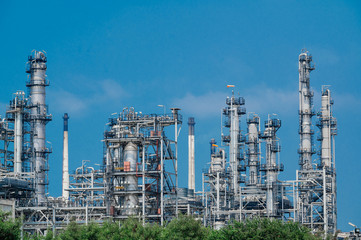 Fototapeta premium Industrial zone,The equipment of oil refining,Close-up of industrial pipelines of an oil-refinery plant,Detail of oil pipeline with valves in large oil refinery.