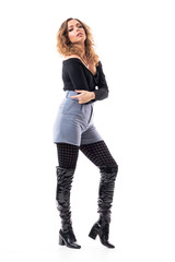 Sexy seductive curly hair young woman posing as fashion model wearing stylish clothing. Full body length isolated on white background.