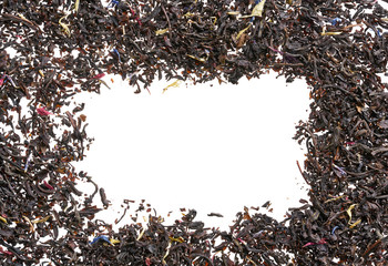 A scattering of elite black tea on a white background