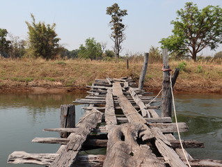 Old wooden bridge in Thailand