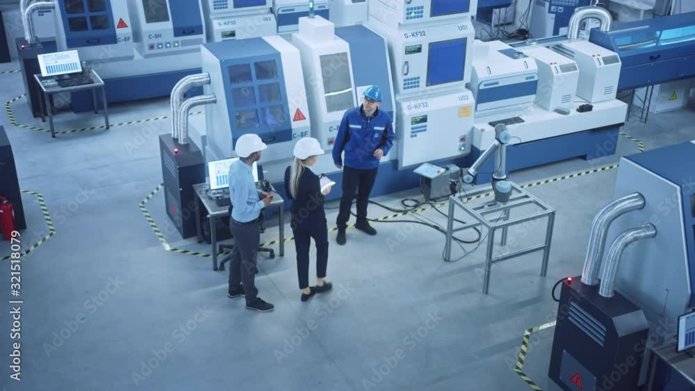 Poster industry four factory: female executive and chief engineer inspect facility workshop, look at robot 
