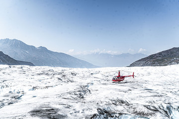 Alaska red helicopter landed on glacier - Knik glacier