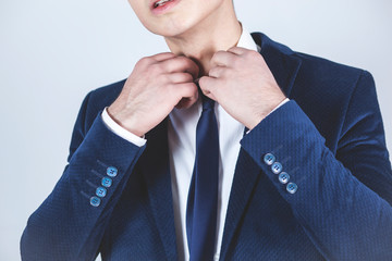 man hand in tie