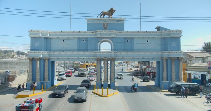 Traffic Entering Xela Quetzaltenango through Monumental Archway Time-lapse