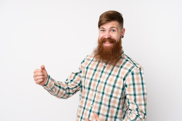 Fototapeta premium Redhead man with long beard over isolated white background making guitar gesture