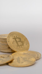 Stack of Bitcoins BTC coins upright on white background