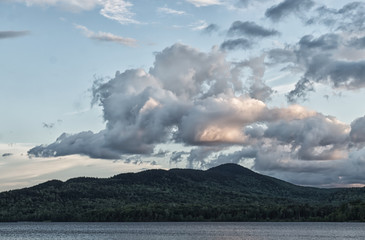 Fototapeta premium clouds over mountains in Moosehead Lake