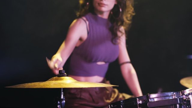 cropped view of girl rehearsing on drums