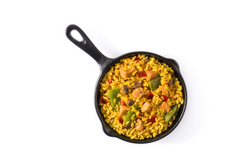 Fried rice with chicken and vegetables on frying iron pan isolated on white background. Top view. Copy space	