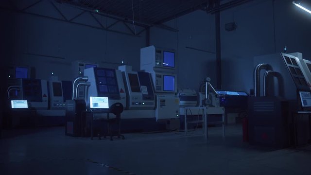 Factory Problem: Lights Blinking, Machinery Working Haphazaradly, Robot Arm Behaving Aggressively in Hacked Modern Facility. Artificial Intelligence Error, Power Failure, Catastrophe Happening.