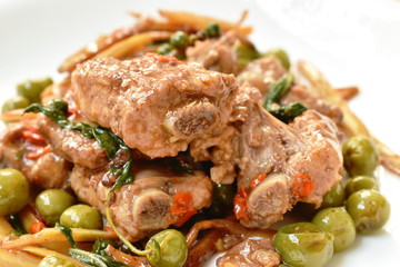 spicy stir fried pork bone with pepper and slice finger root on plate