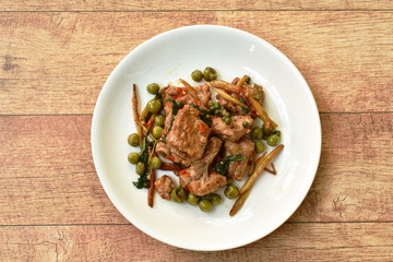 spicy stir fried pork bone with pepper and slice finger root on plate