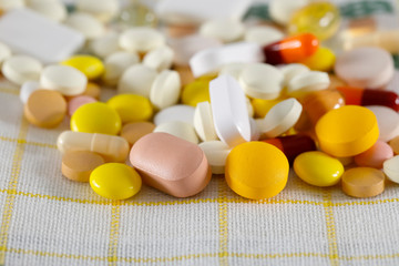 Colorful pills on a napkin