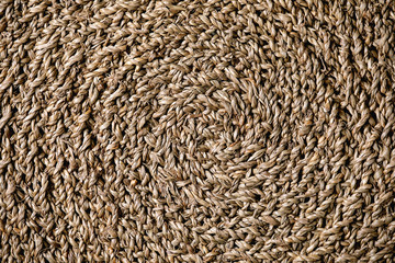 Straw wicker beige eco friendly spiral abstract background copy space