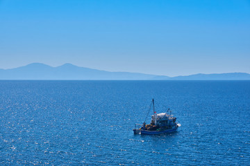 Fishing boat on the water catching fish