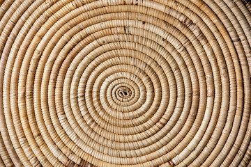 Naklejka premium Straw wicker beige eco friendly spiral abstract background copy space