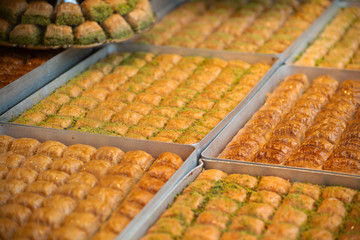 wallnut, pistachio turkish style antep baklava banner presentation. Traditional turkish delight dessert. Havuc dilimi.