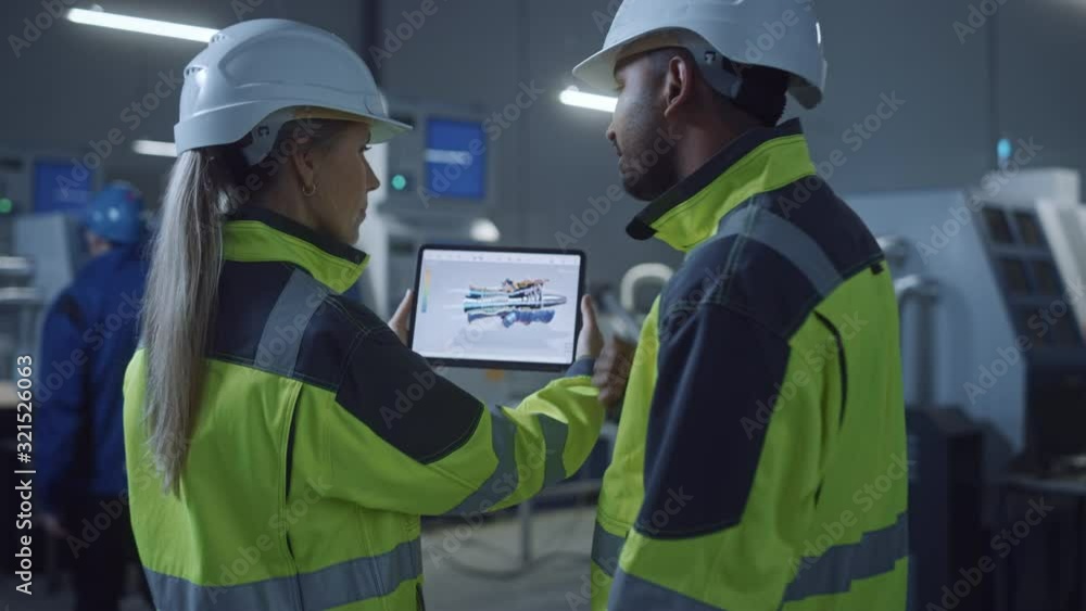Poster Industry 4.0 Factory: Chief Engineer and Project Supervisor in Safety Vests and Hard Hats, Talk, Use Digital Tablet Computer, Screen Shows 3D Concept Prototype of New Engine. Zoom out