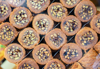 wallnut, pistachio turkish style antep baklava banner presentation. Traditional turkish delight dessert. Havuc dilimi.