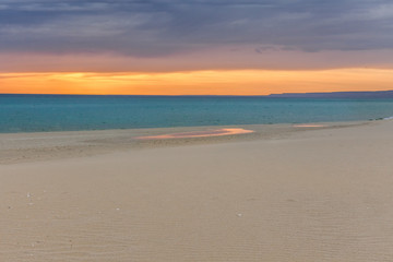 Stormy sunset over the Caspian sea coast. background of a beautiful orange-red sunset on the Caspian sea . selective focus