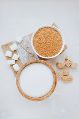 Composition with sugar, different types of sugar, cane and white, lump and sugar sand. Top view,...