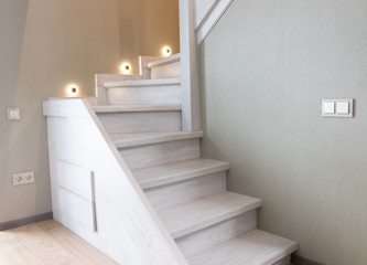  beautiful wooden staircase with home lighting