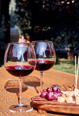 Glasses Of Fine Red Wine With Grape and Cheese