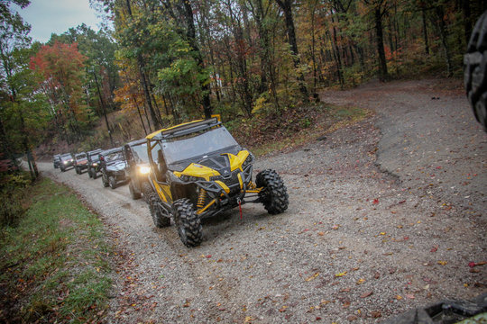 Utv's in a line on wooded trail in TN