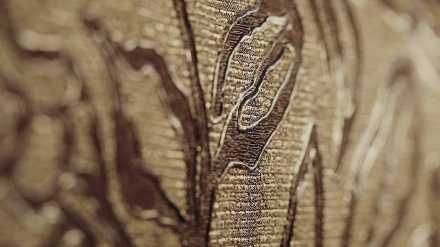 Rolls with wallpaper. Ornament close-up. Stand with wallpaper in the store