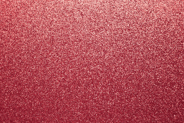 Shiny red fabric. Shimmering sequin texture. Abstract sparkle cloth, pattern. Brilliance textile background.
