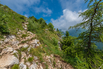 Fototapeta na wymiar Fragment of a nice mountain view from the trail at Monte Baldo in Italy.