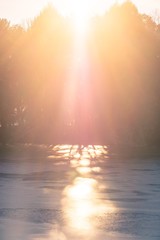sun reflecting on ice river