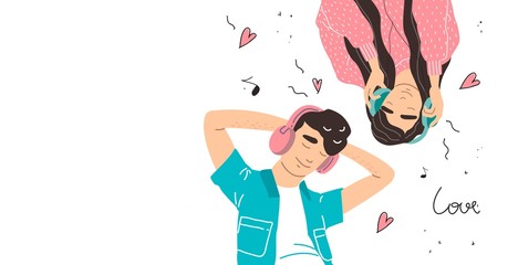 Lovers boy and girl listen to music on headphones