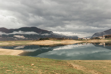 Landscape photo of Rama lake in Bosnia and Herzegovina. Rainy day with heavy clouds, after windstorm. 