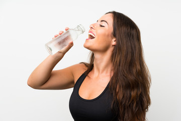 Young woman over isolated white background with a bottle of water